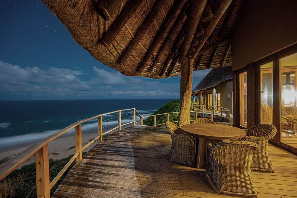 A deck lounge overlooking the beautiful star-filled night sky and white sandy beaches of Mozambique